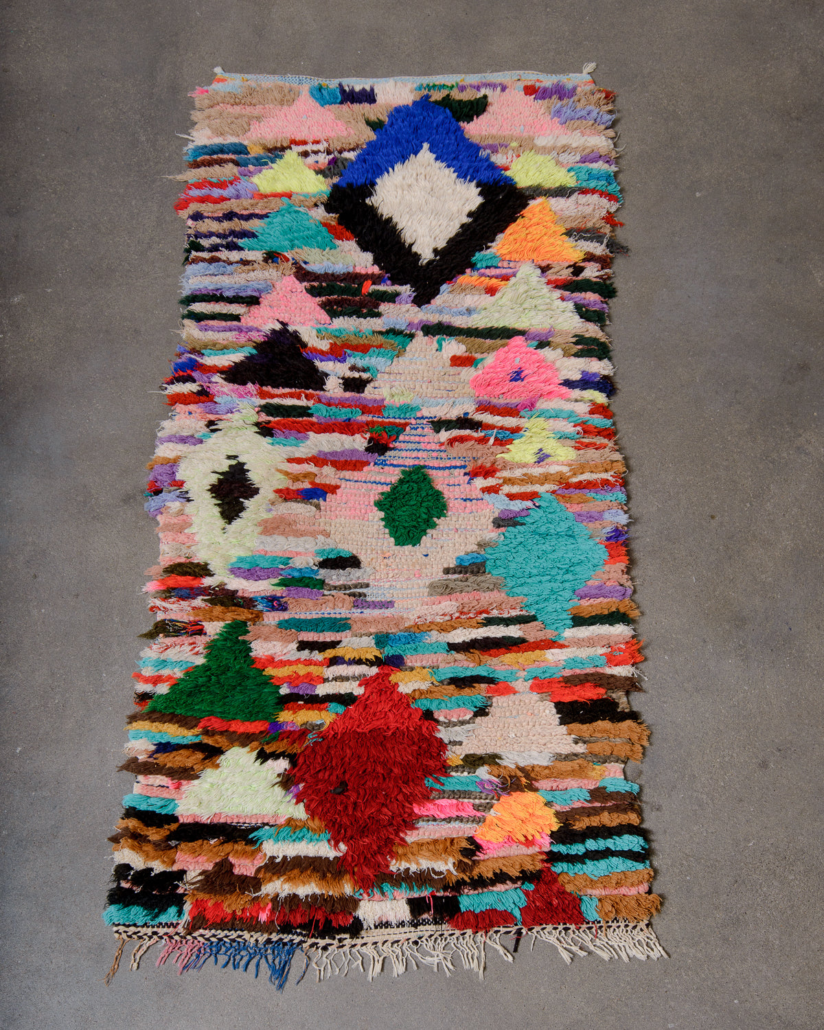 Modern designer vintage handcrafted Berber rug from Morocco. Boucherouite runner rug with beautiful colors and patterns.